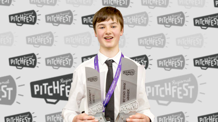 Michael Nixon holds his trophies after winning Regional Pitchfest